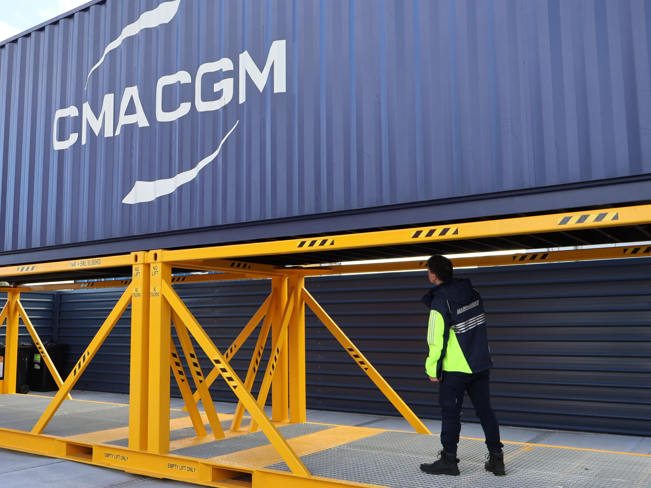 Team inspecting container and cleaning it