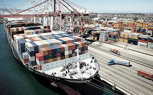 Vessel arriving into port after delay - LCL-Container-arriving-at-wharf