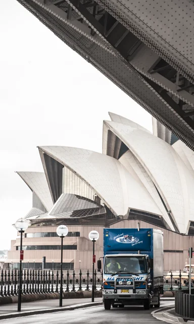 Importing into Australia - Mainfreight Truck at the Sydney Opera House
