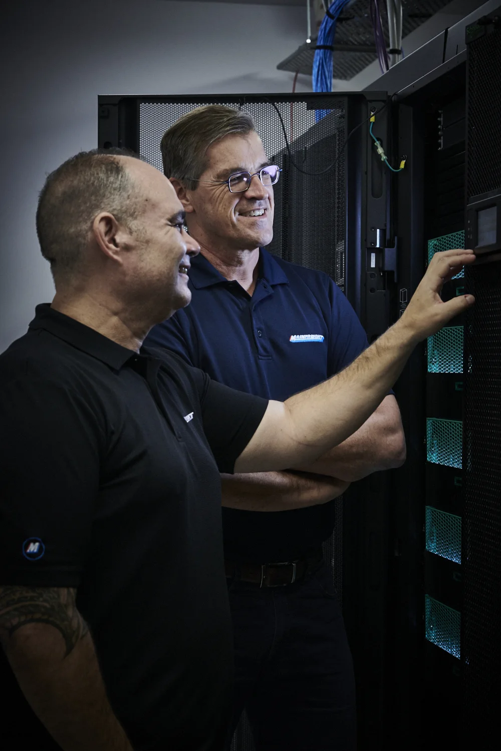 Mainfreight Technology Automation Transport - Two Mainfreight Team Members and Transport Technology